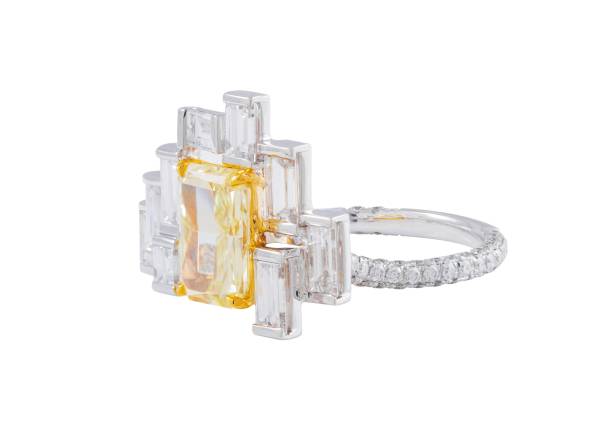 istock Elegant yellow diamond ring with baguette-cut diamonds on a white background 2175975817