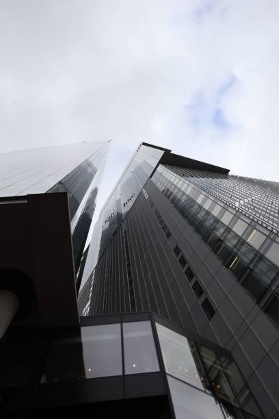 istock Low angle view of modern skyscrapers against a cloudy sky. 2175977569