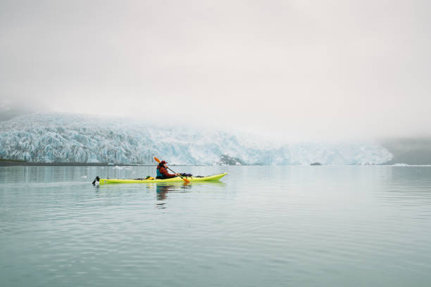 istock Woman Kayaking by a Glacier in Alaska 2175980053