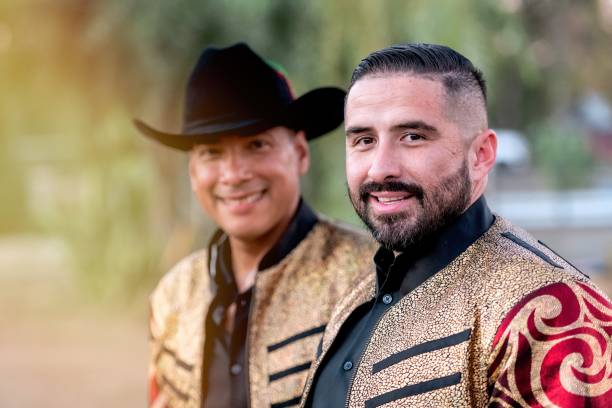 Smiling hispanic musicians posing looking at the camera