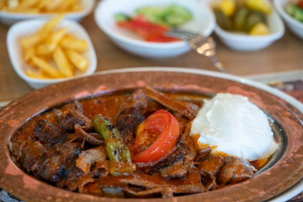 Iskender, translated as Alexander (the Great) Kebab is a well known ultra high calorie gourmet Turkish dish of Bursa made from high quality beef and typically enjoyed with yogurt and melted butter.
