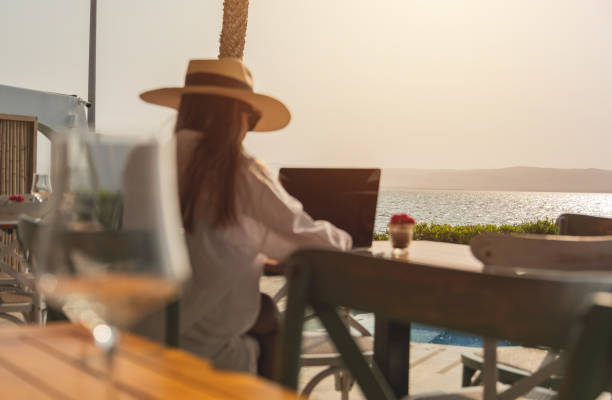 istock Beautiful Young Woman Working on Laptop Computer Outdoors In Summer Season, remote work concept 2175995052