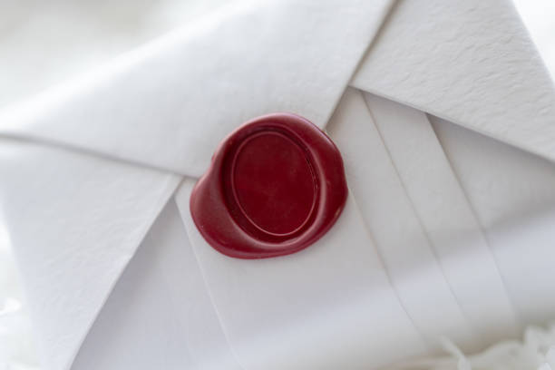 Wax seal stamp on white paper wrap packaging parcel box