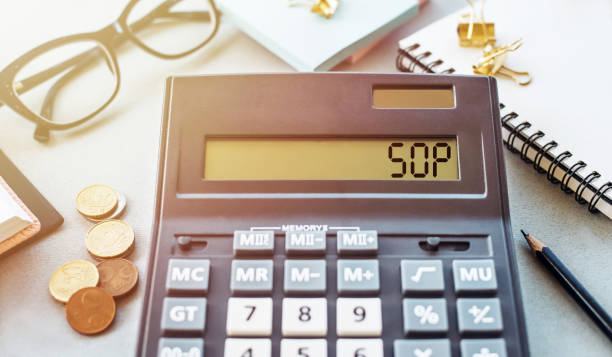 istock Standard Operating Procedures Concept With Calculator Displaying SOP on Desk 2176002073