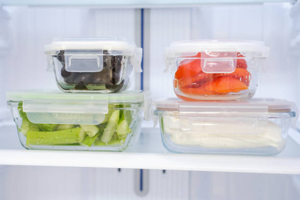 istock Glass boxes with vegetables in refrigerator front view, concept food storage. 2176011020