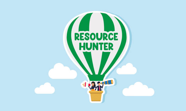 istock A businessman using binoculars and a businesswoman speak with megaphone are in a hot air balloon labeled Resource Hunter, an illustration of search for potential resources for business. 2176021402