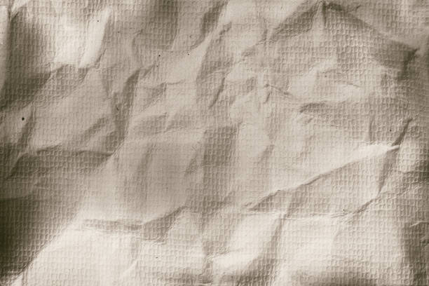 Brown crumpled vintage old Cardboard paper texture background for design in your work surface concept.