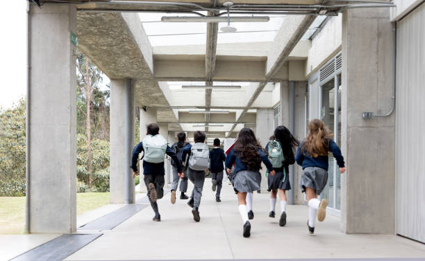 istock Students running to their classroom at the school 2176025163