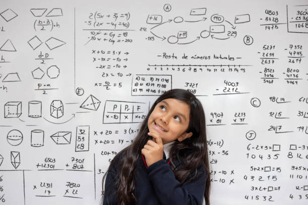 istock Thoughtful schoolgirl thinking about a mathematical problem at the school 2176025208