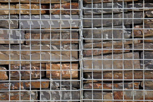 Fence with gabions and stones