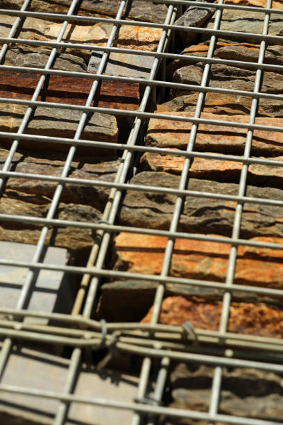 Fence with gabions and stones