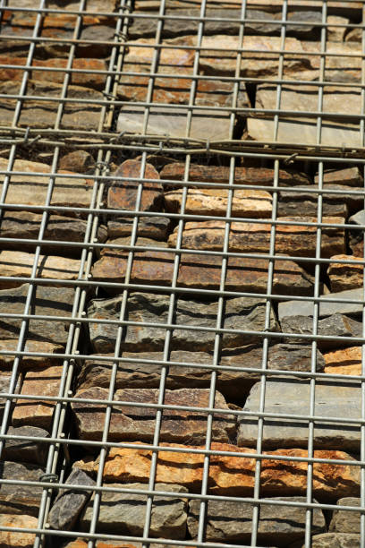Fence with gabions and stones