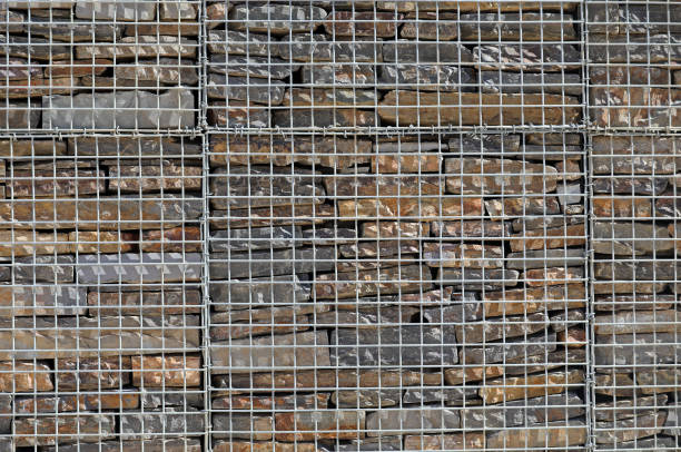 Fence with gabions and stones