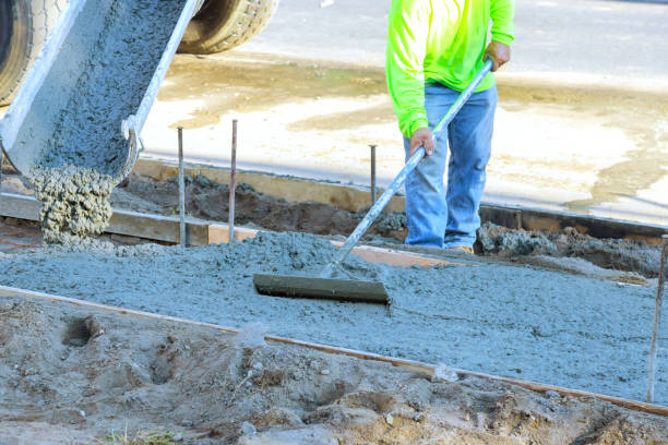 istock New sidewalk being constructed with fresh concrete being poured on reinforced bars by a concrete mixer truck 2176038393