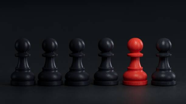 istock A RED chess piece that is different from the other BLACK chess pieces. concept of difference.3D rendering on black background. 2176040451