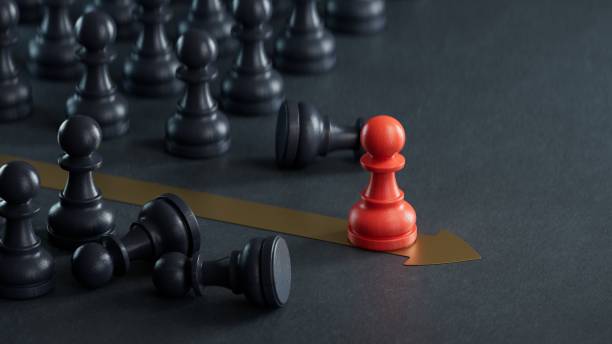 istock RED pawn beating competition over black background. Standing out from the crowd. Business strategy, outsider becoming the leader.3D rendering on black background. 2176040538