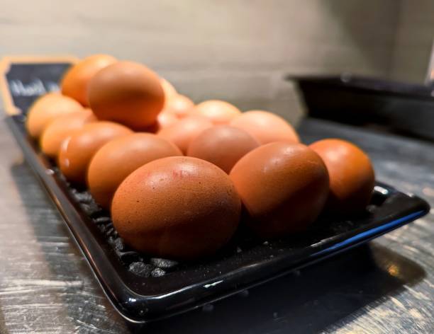 istock Boiled eggs in their shells on a tray during a hotel breakfast buffet 2176043712
