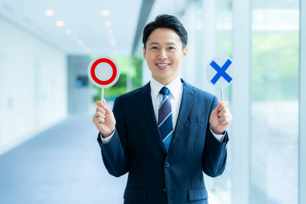 istock Businessman holding a round cross plate 2176047245