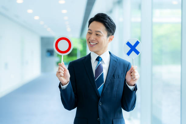 Businessman holding a round cross plate