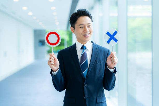 istock Businessman holding a round cross plate 2176047260