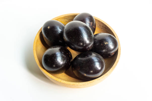istock Grilled salted eggs on wooden bowl. Salted eggs are usually made from duck eggs fermented with ash and salt. 2176051641