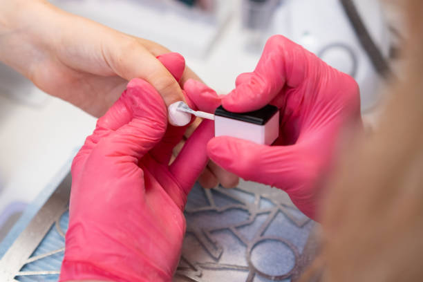 istock Applying gel polish on nails during a manicure session at a nail salon 2176060284