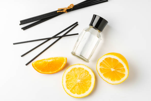 istock Aromatic display of essential oils with citrus fruit and chopsticks on a minimalist background 2176061258