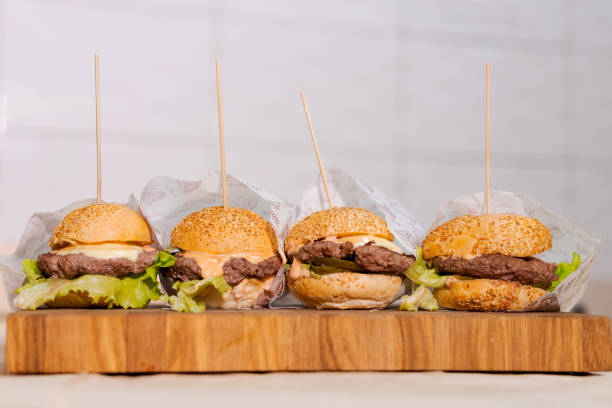 istock Four hamburgers with toothpicks in them 2176061338