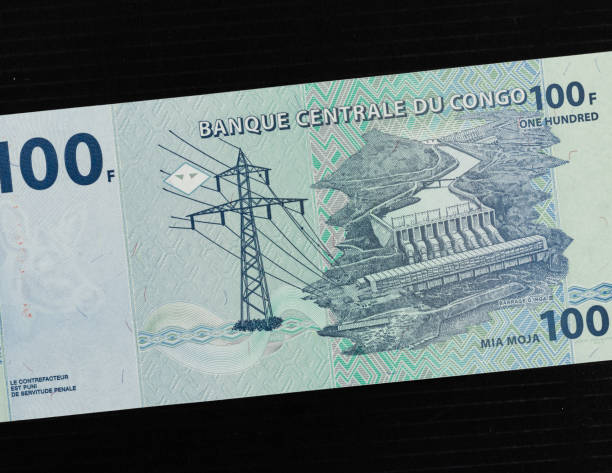 istock Congo 100 franc banknotes featuring the Inga II hydroelectric dam power facility on the Congo river. 2176061561