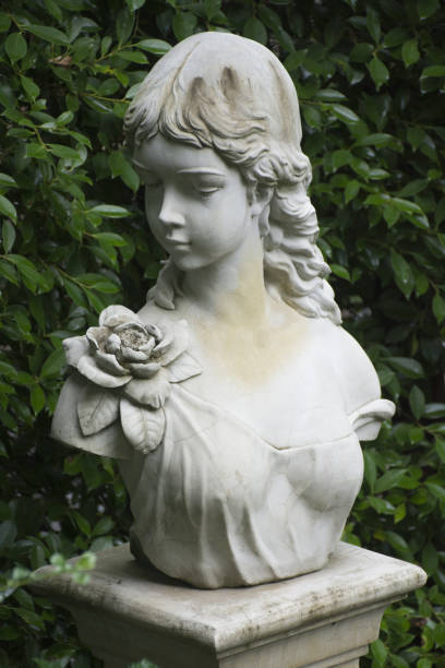 istock Old portrait sculpture in forest 2176064652