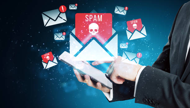 istock Spam email notifications on a tablet with skull icons representing cybersecurity threats. 2176066282
