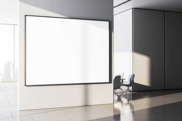 istock Modern office interior with large blank poster frame on the wall. 3D Rendering 2176066346