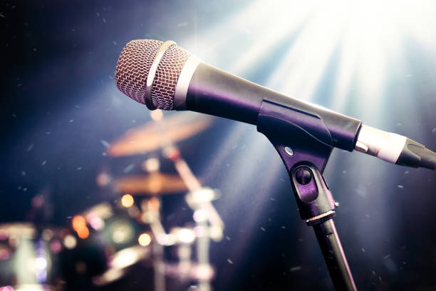 istock Live music venue featuring microphone and instruments on stage 2176066429