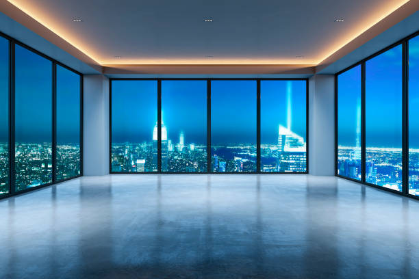 istock Modern unfurnished office room with large windows overlooking city skyline at night. 3D Rendering 2176066599