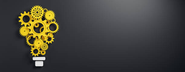 istock Yellow gears forming a lightbulb shape on a dark background. 3D Rendering 2176066808