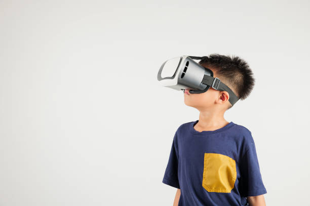 istock Smiling young kid boy confidence excited wear VR headset device during virtual reality experience isolated white background, Asian happy portrait primary child playing video game 2176069756