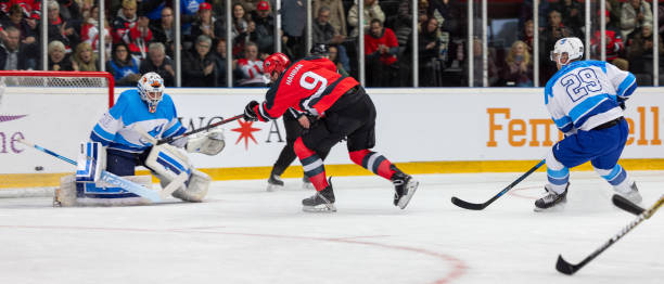 istock Ice hockey player scoring goal 2176074423