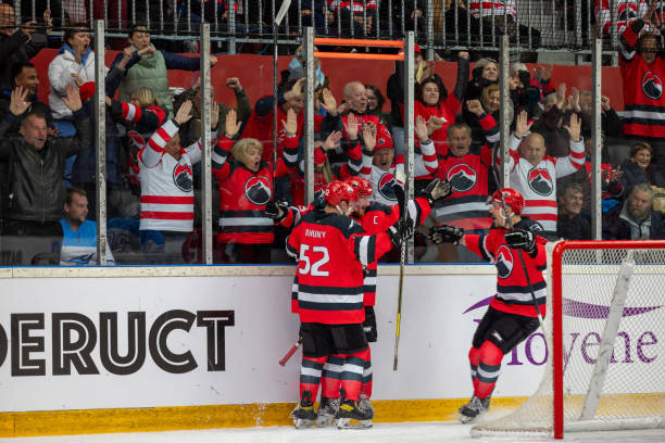 istock Hockey Team Celebrating a Goal 2176074448
