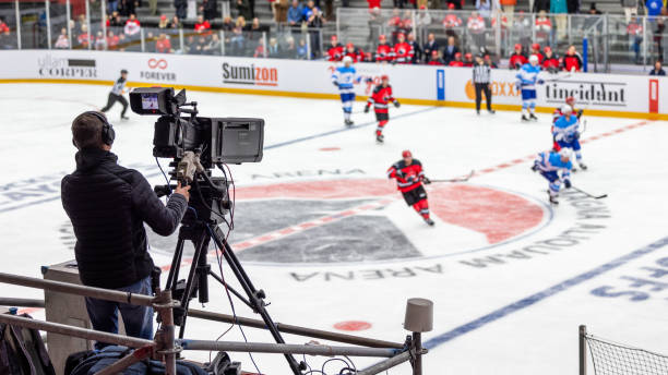 istock Cameraman Filming an Ice Hockey Match from an Elevated Position 2176074453