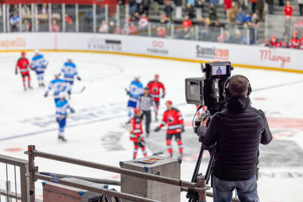 istock Cameraman Capturing Ice Hockey Action 2176074459