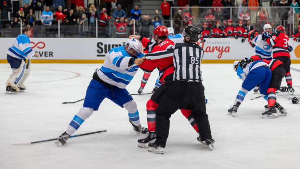 istock Hockey Players in Intense Mid-Game Fight 2176074474