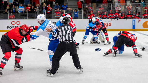 istock Ice hockey players fighting on rink 2176074482