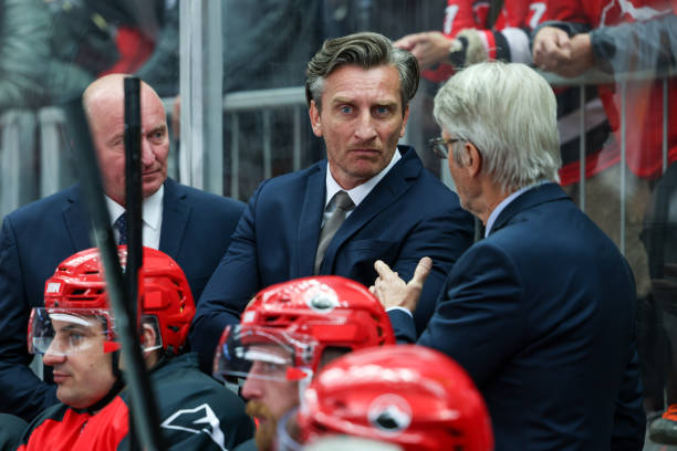 istock Ice Hockey Coaches Strategizing During the Game 2176074570