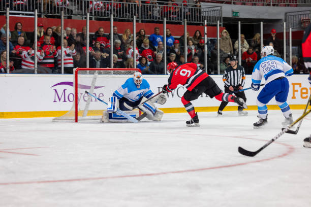 istock Goalie Blocking a Shot on Goal 2176074651