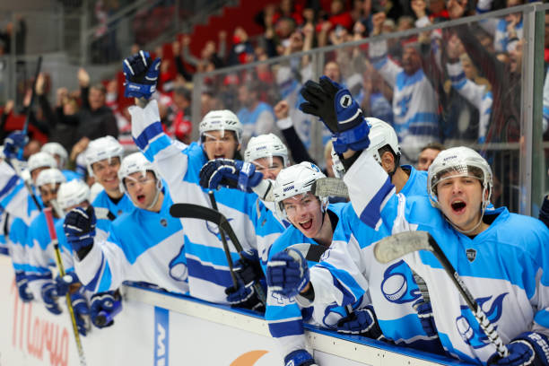 istock Hockey Team Cheering from the Bench 2176074681