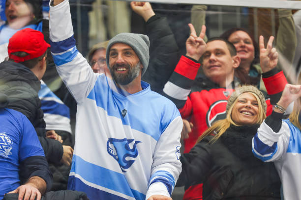 istock Joyful Hockey Fans Celebrating a Victory 2176074712