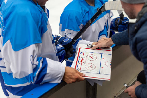 Hockey Team Strategy Discussion with Coach