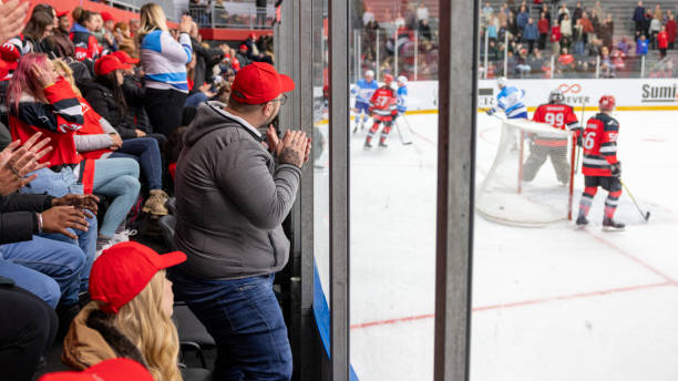 istock Enthusiastic Fans Watching Ice Hockey Match 2176075277