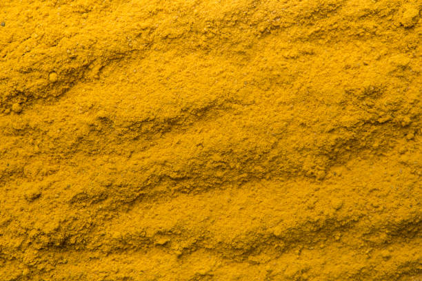 istock Turmeric powder texture nature background. Herbal asian spices 2176075942