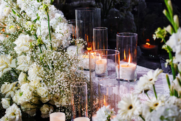 istock Large glass glasses, candlesticks with burning candles. 2176077929